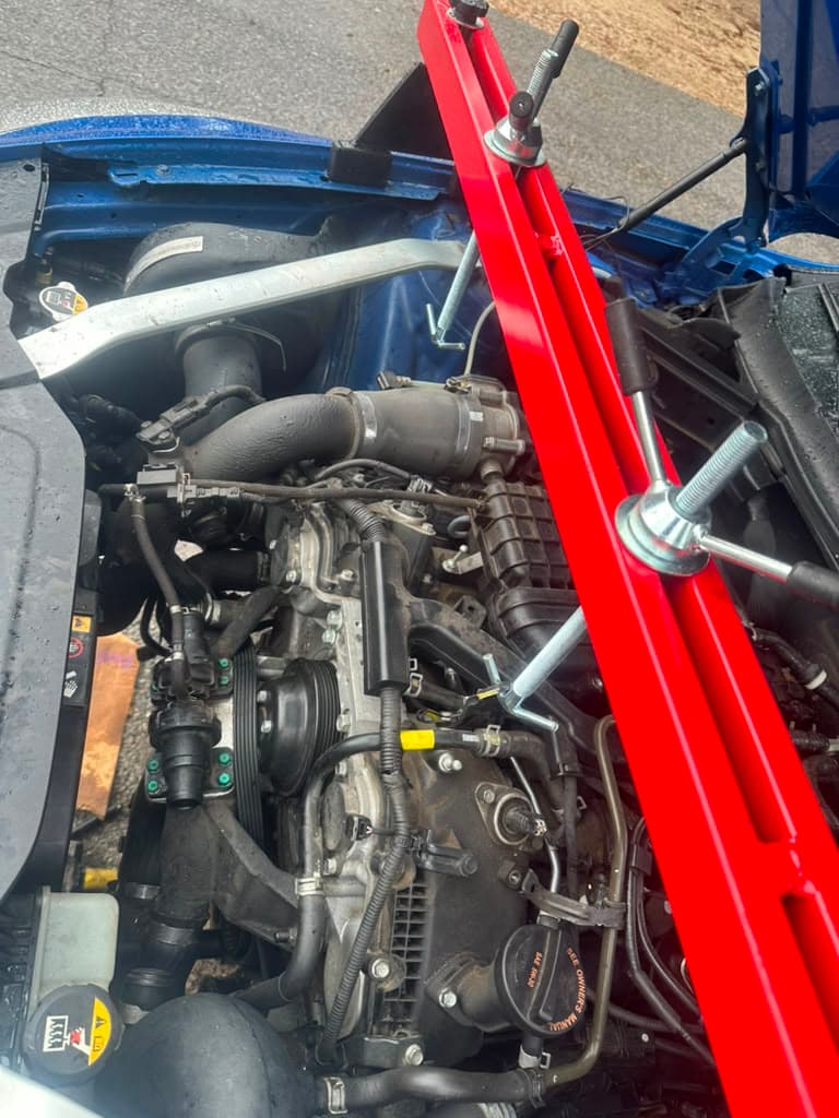 Engine bay detail with strut brace installed