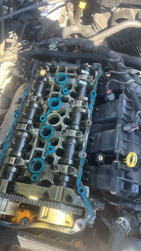 Valve cover and camshaft repair in progress